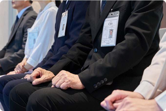 A Group of people sitting in a row