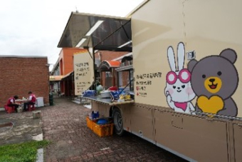 A food truck with a cartoon character on the side